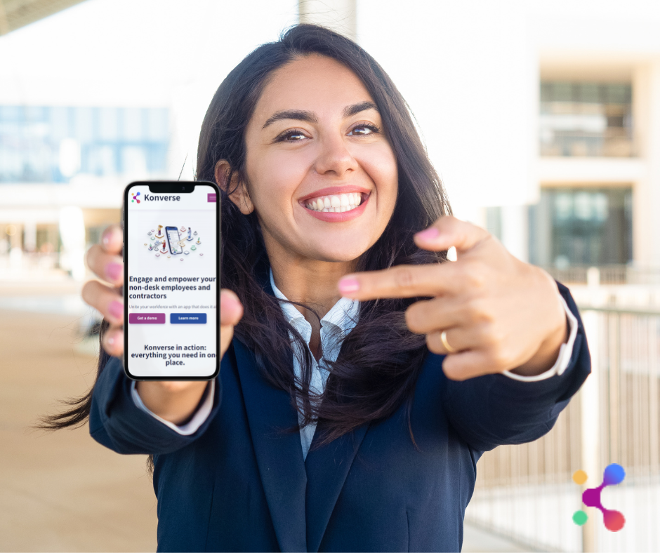 hospitality worker showing Konverse mobile app